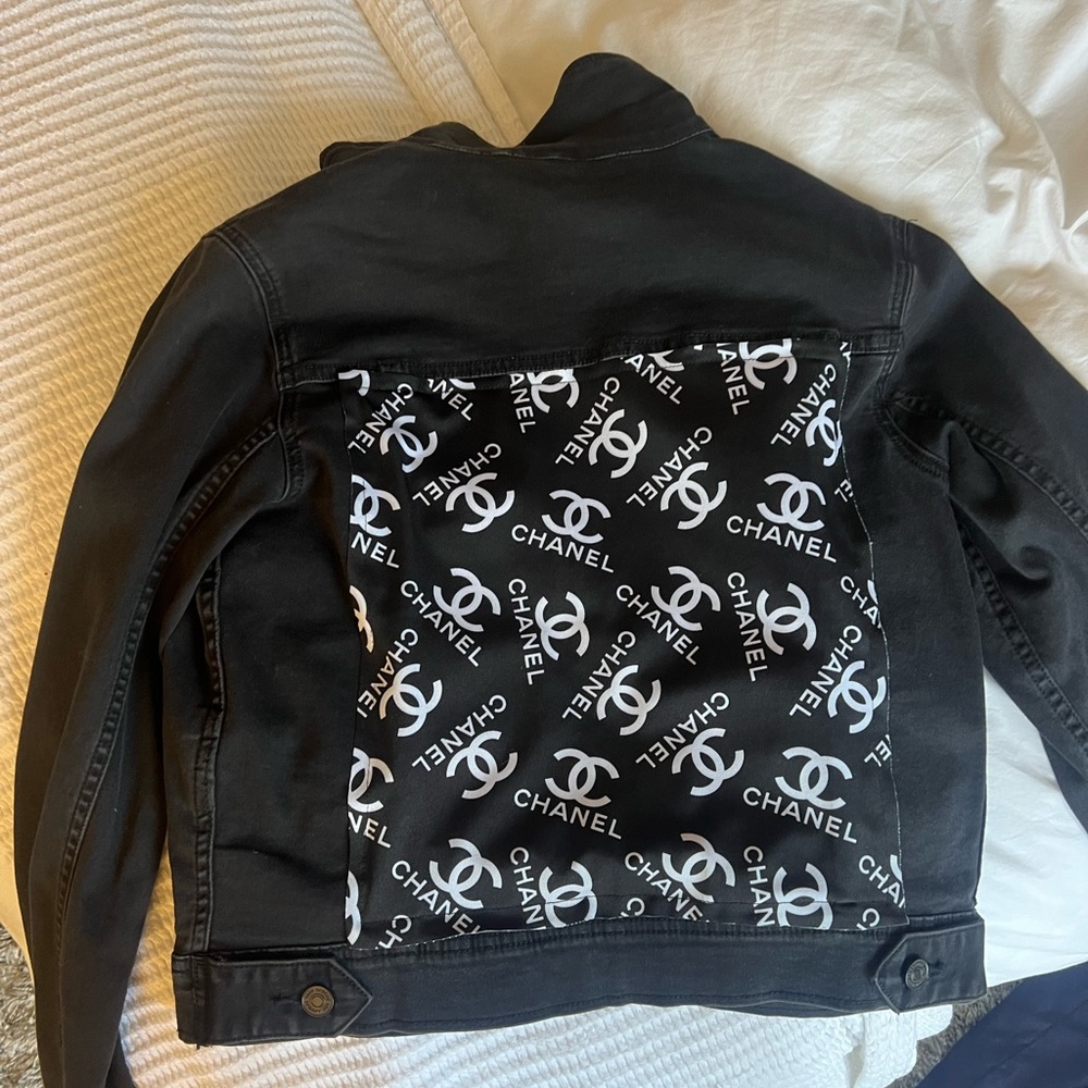 Black Jean jacket with Chanel logo on the back